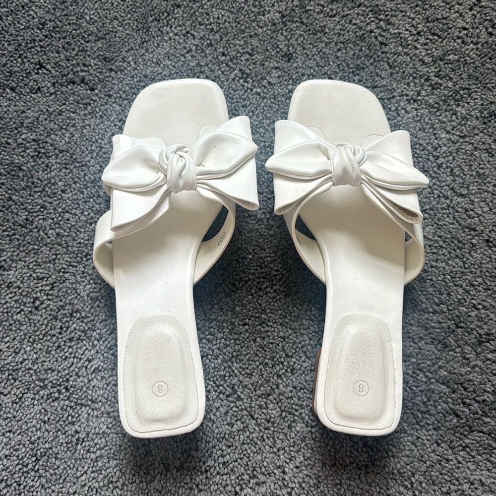 White bow high heels